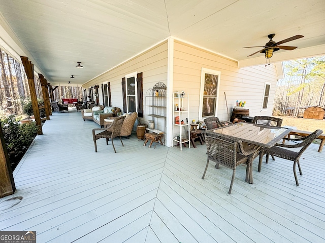 deck with ceiling fan and an outdoor hangout area