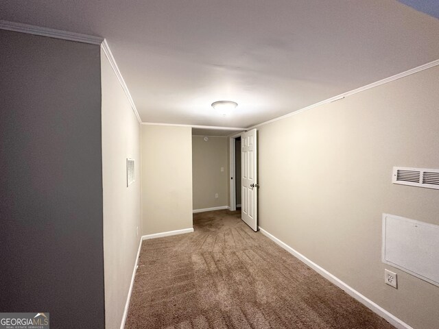 carpeted empty room with crown molding