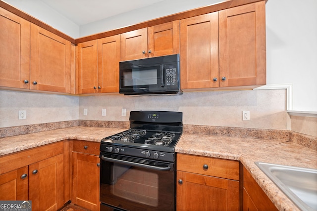 kitchen with decorative backsplash and black appliances