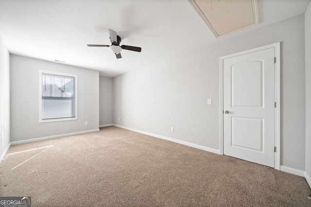 carpeted empty room with ceiling fan