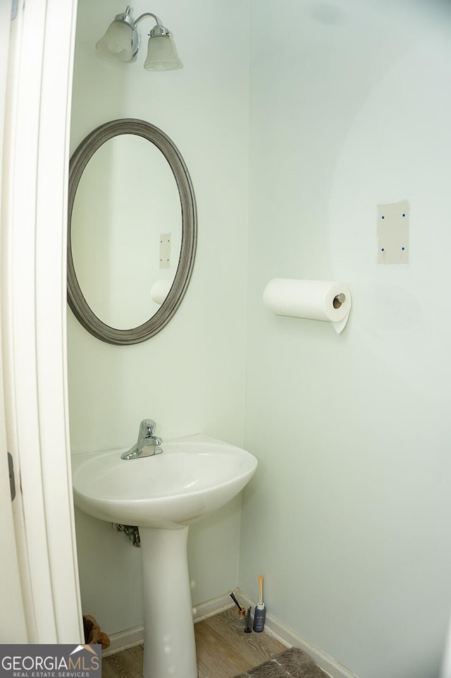 bathroom with hardwood / wood-style flooring