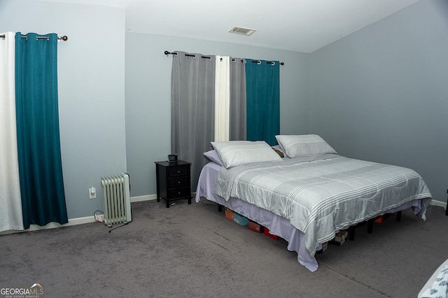 carpeted bedroom featuring radiator heating unit