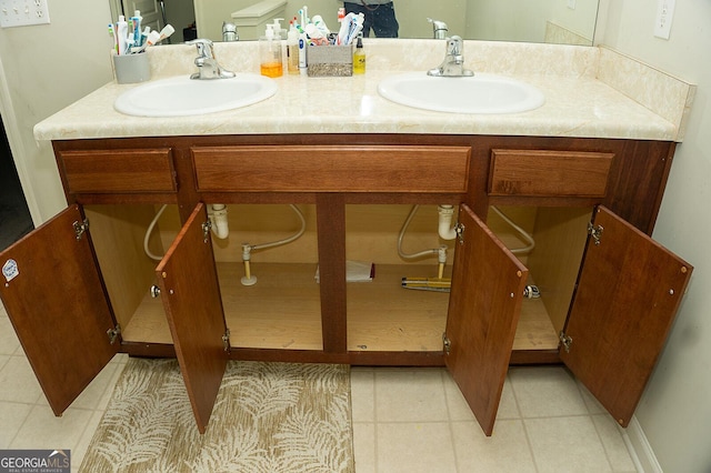 bathroom with tile patterned flooring and vanity