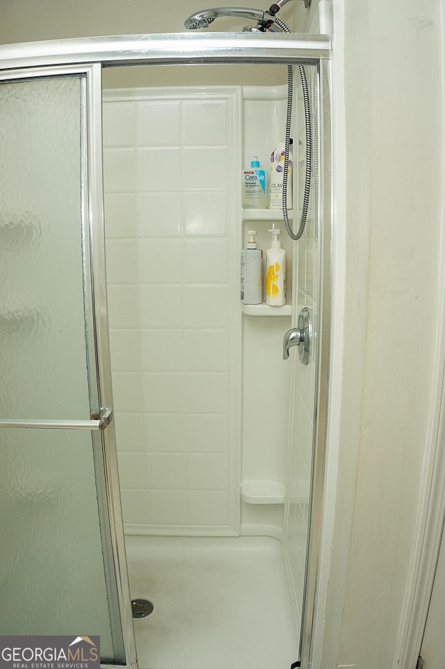 bathroom with an enclosed shower