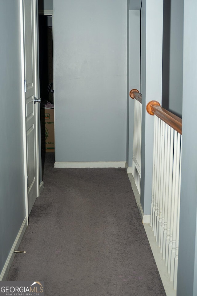 corridor with dark carpet