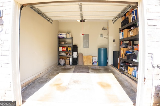 garage with electric panel and a garage door opener