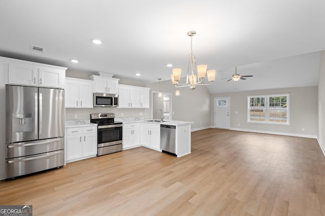 kitchen featuring sink, white cabinets, and stainless steel appliances