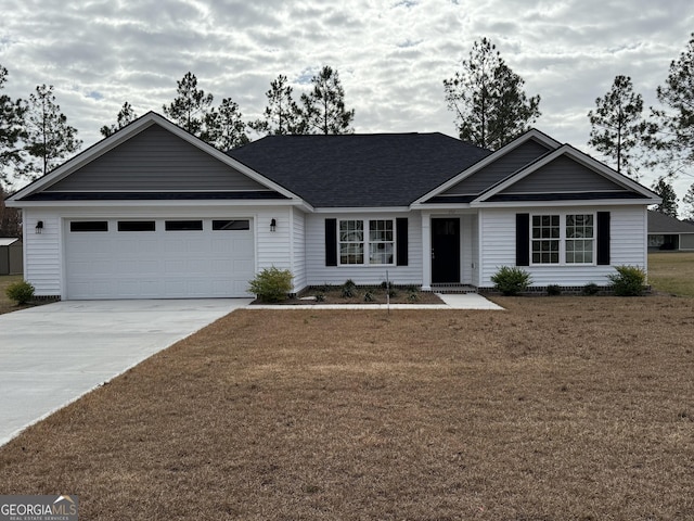 ranch-style home with a garage and a front yard