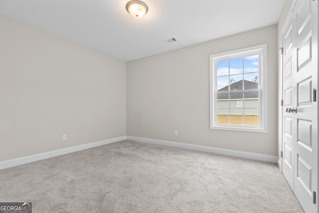 view of carpeted spare room