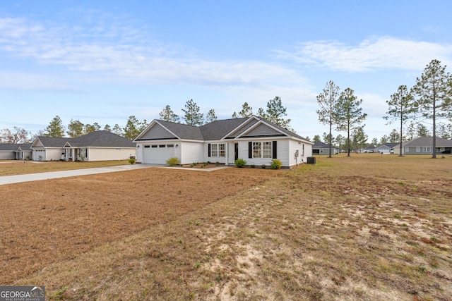 single story home featuring a front yard and a garage