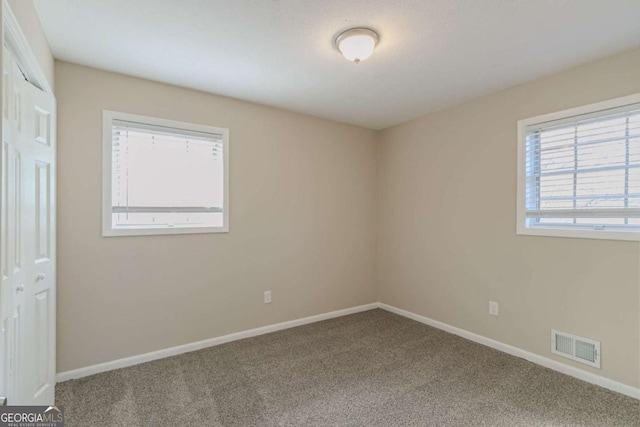 empty room with carpet floors