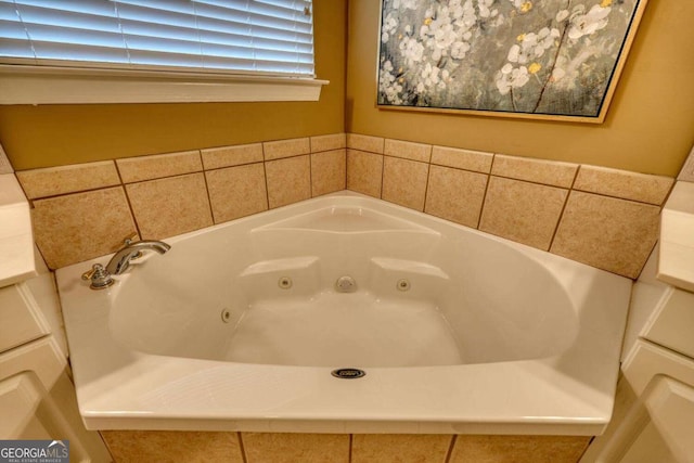 bathroom featuring tiled tub