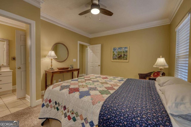 bedroom featuring connected bathroom, ceiling fan, a textured ceiling, light tile patterned floors, and ornamental molding