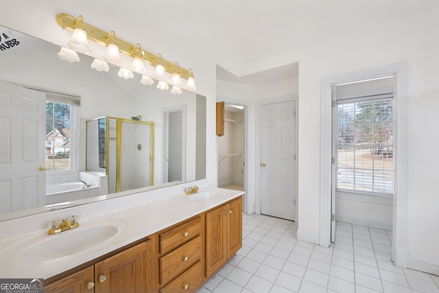 bathroom featuring separate shower and tub, vanity, and tile patterned floors