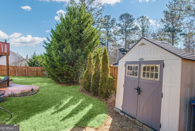 view of yard featuring a patio and a shed