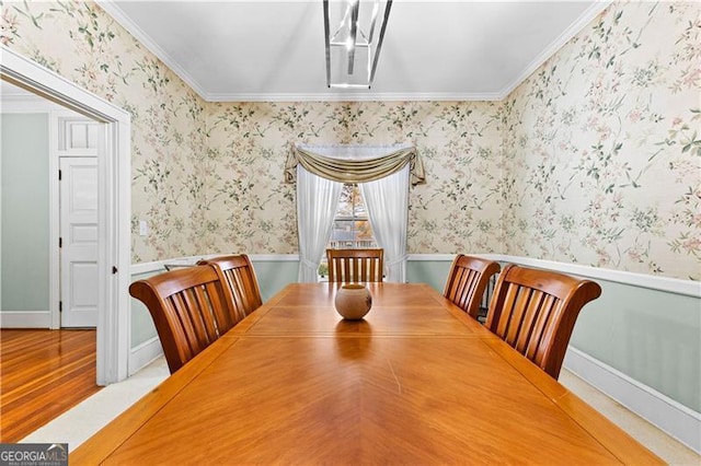 dining room featuring wood-type flooring and ornamental molding