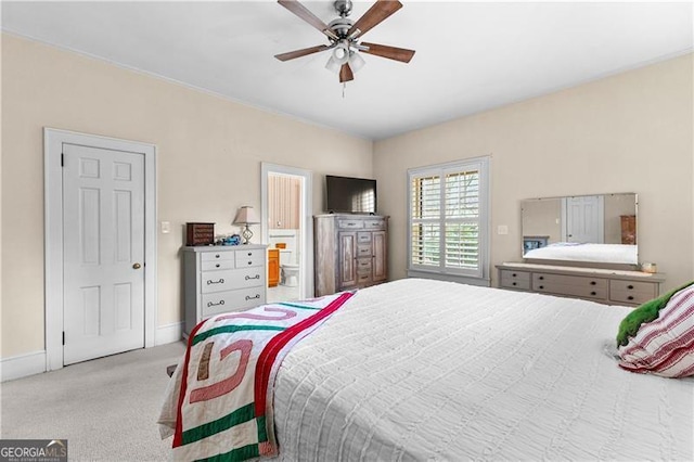 carpeted bedroom with ceiling fan