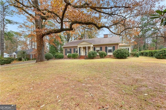 ranch-style house with a front yard