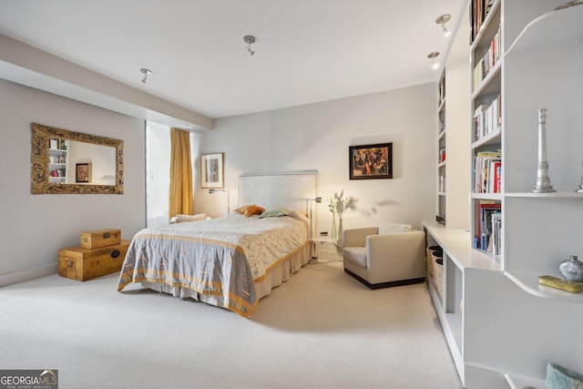 bedroom featuring light carpet