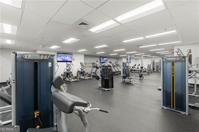 workout area featuring a drop ceiling