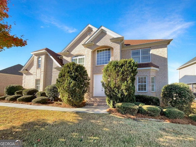 front facade with a front lawn