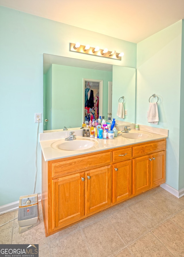 bathroom with tile patterned floors and vanity