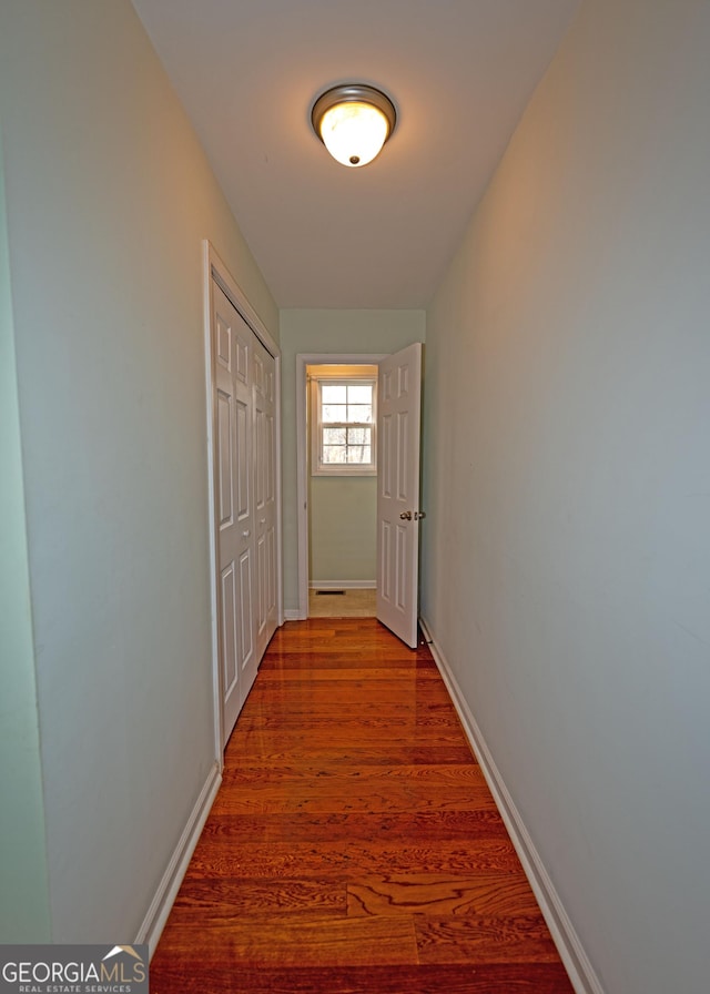 hall with light hardwood / wood-style floors