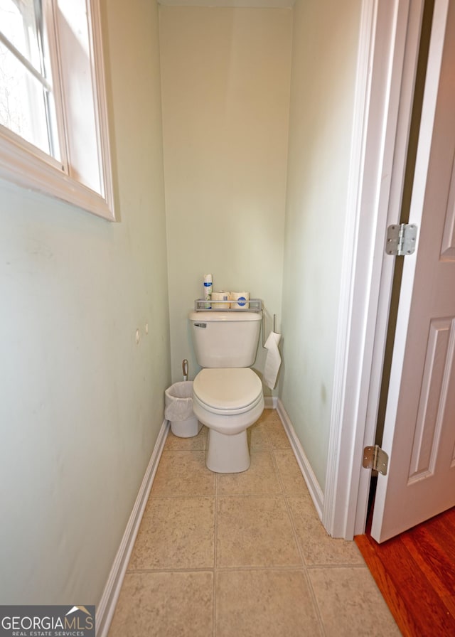 bathroom featuring tile patterned flooring and toilet