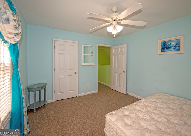 carpeted bedroom with ceiling fan