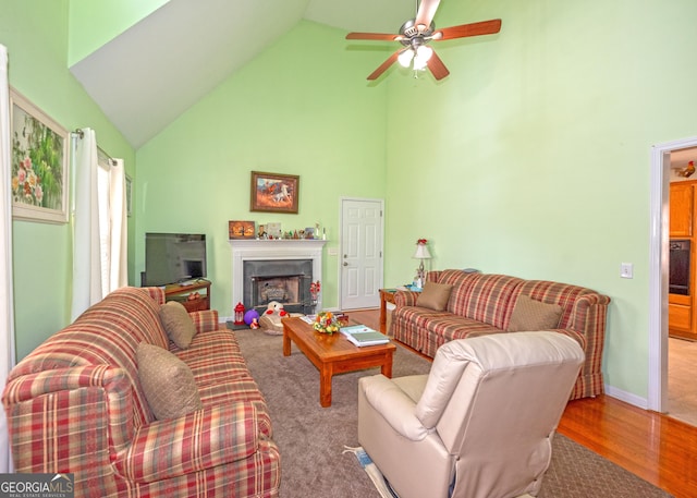 living room featuring ceiling fan, wood-type flooring, and high vaulted ceiling