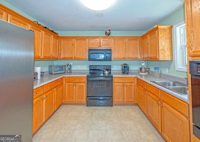 kitchen featuring sink and black appliances