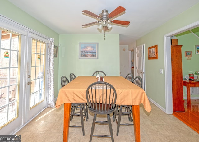 tiled dining room featuring ceiling fan