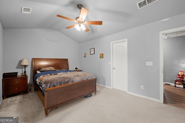 carpeted bedroom featuring ceiling fan and lofted ceiling