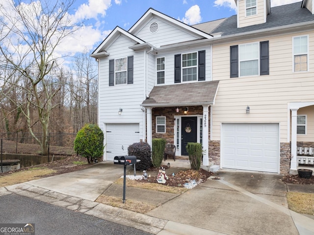 townhome / multi-family property featuring a garage