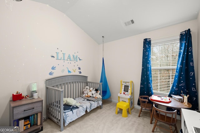 carpeted bedroom featuring vaulted ceiling