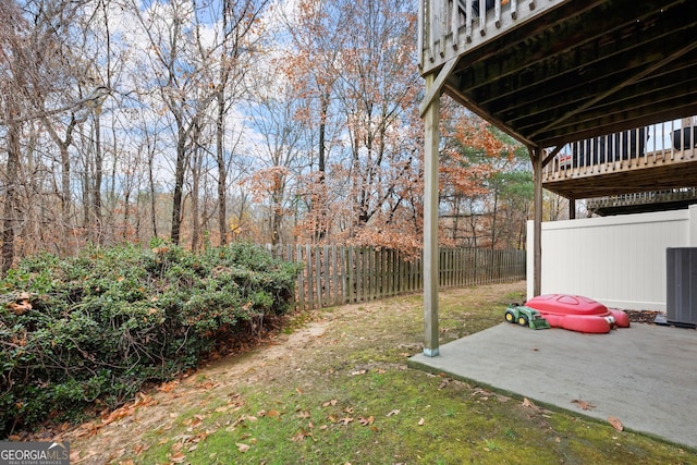 view of yard with a patio area and a wooden deck