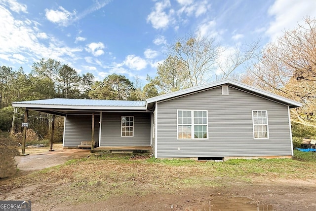 exterior space with a carport