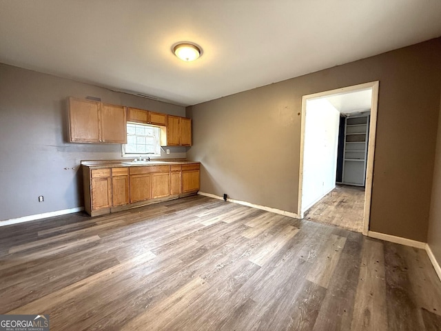 kitchen featuring sink and light wood-type flooring