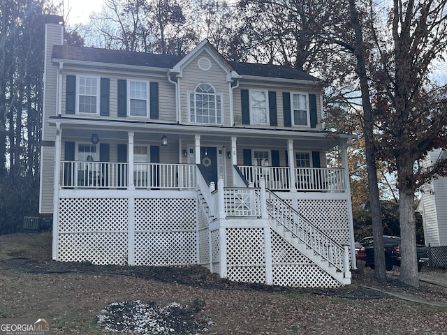 view of front facade featuring a porch and cooling unit