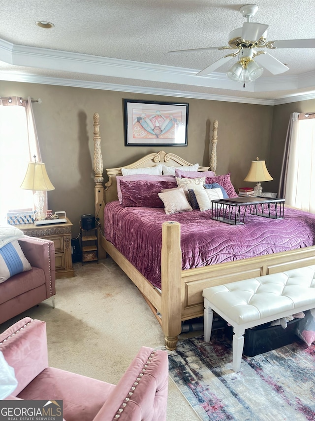 bedroom featuring a textured ceiling, ceiling fan, and carpet