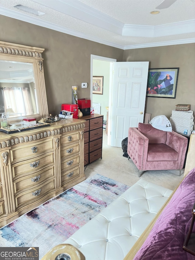 carpeted bedroom with crown molding and a textured ceiling