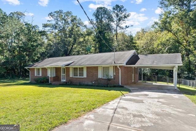 ranch-style house featuring a front lawn and a carport