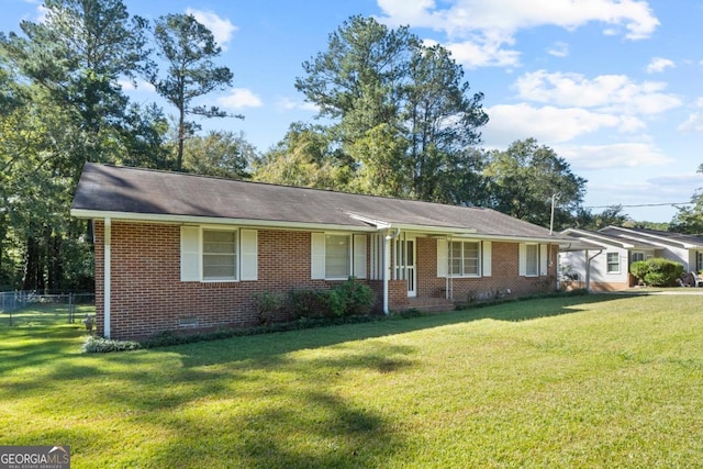 ranch-style home featuring a front yard