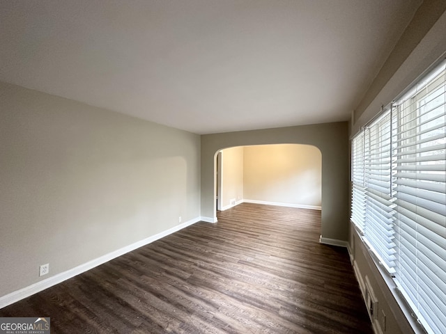 spare room featuring dark hardwood / wood-style floors