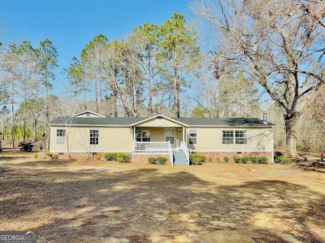 single story home featuring a porch and crawl space