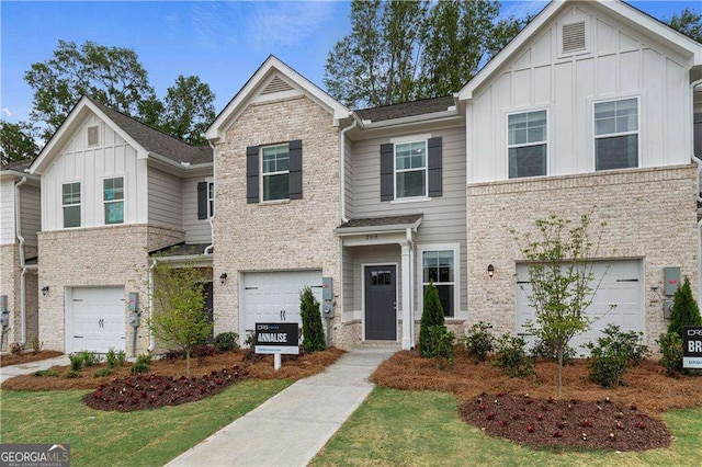 view of front of house with a front yard and a garage