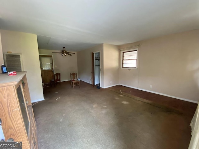 unfurnished living room with ceiling fan