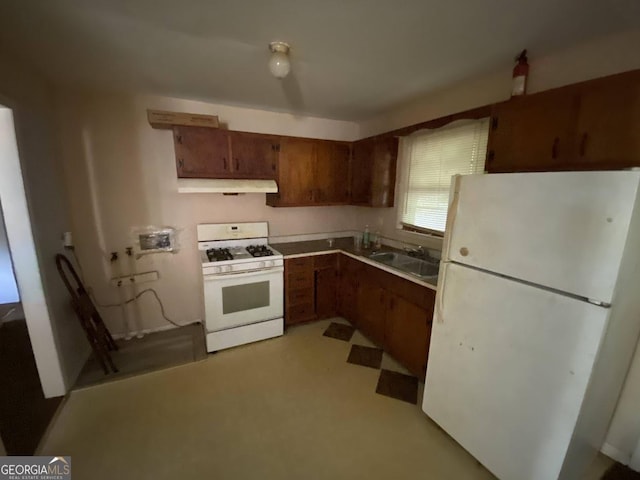 kitchen with sink and white appliances