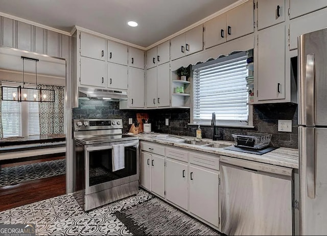 kitchen with sink, white cabinetry, and stainless steel appliances