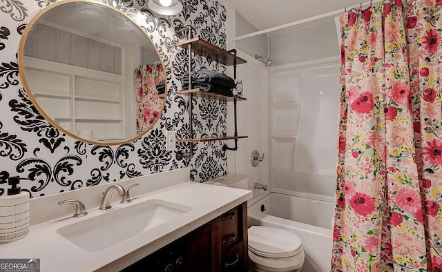 full bathroom with shower / bathtub combination with curtain, vanity, and toilet